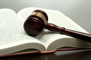 Erosion of Natural Law Image of a legal book and gavel